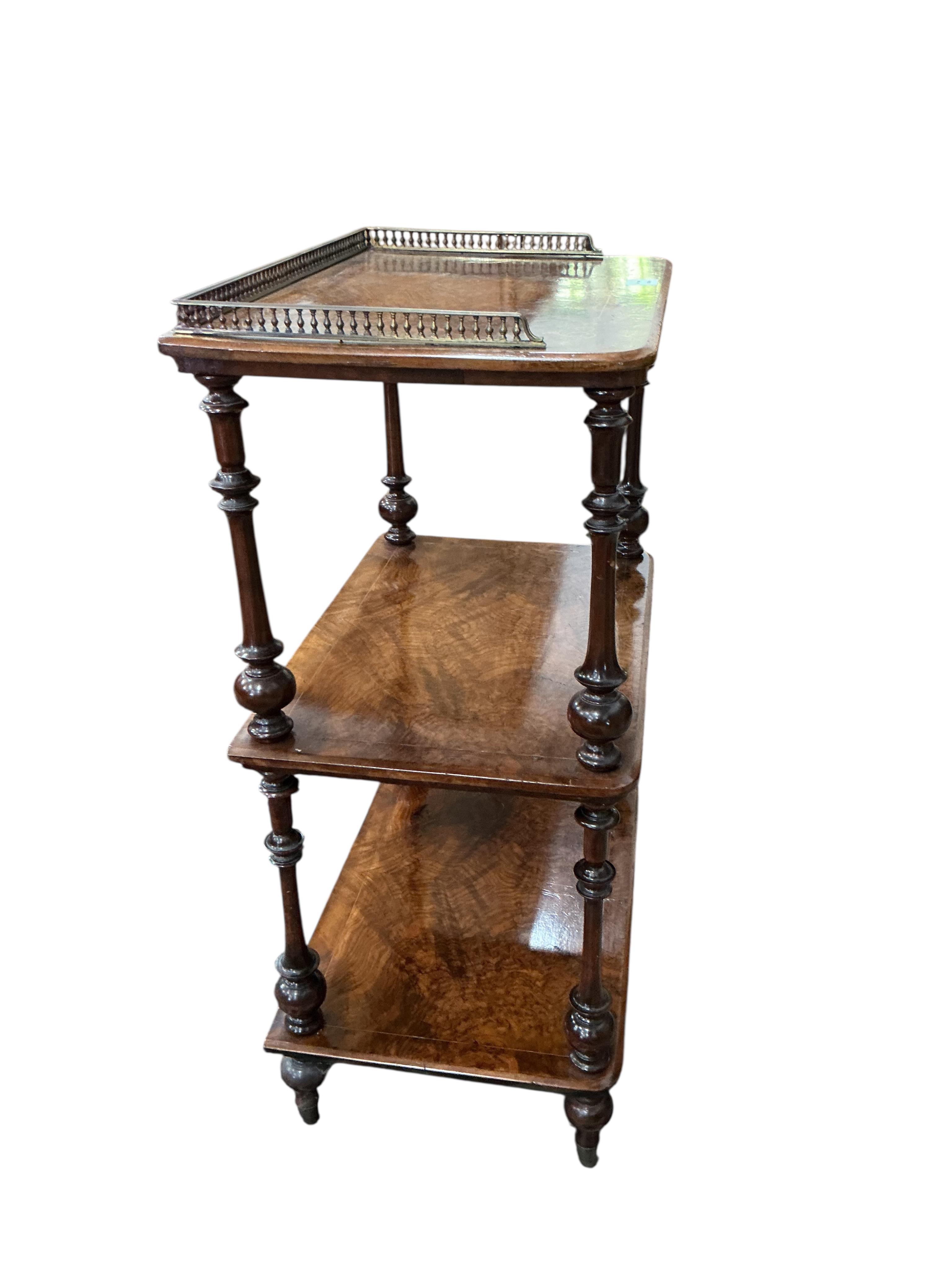 A Victorian walnut three tier whatnot, width 60cm, depth 40cm, height 95cm